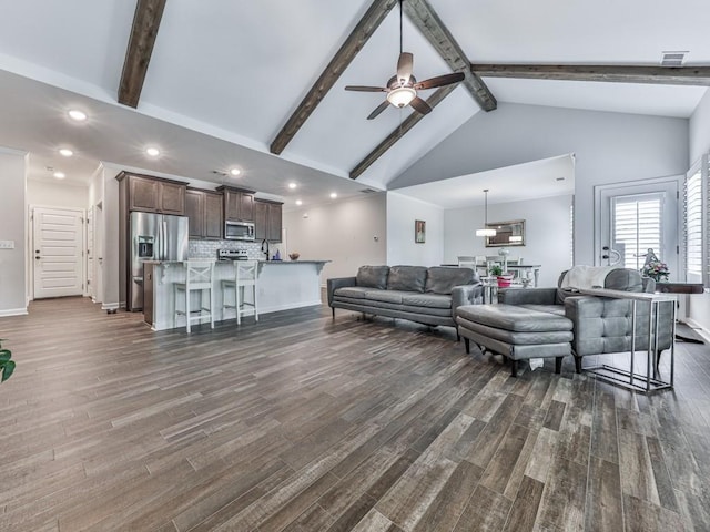 living area with a ceiling fan, beam ceiling, dark wood-style flooring, high vaulted ceiling, and recessed lighting
