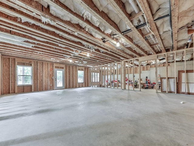 miscellaneous room featuring unfinished concrete flooring