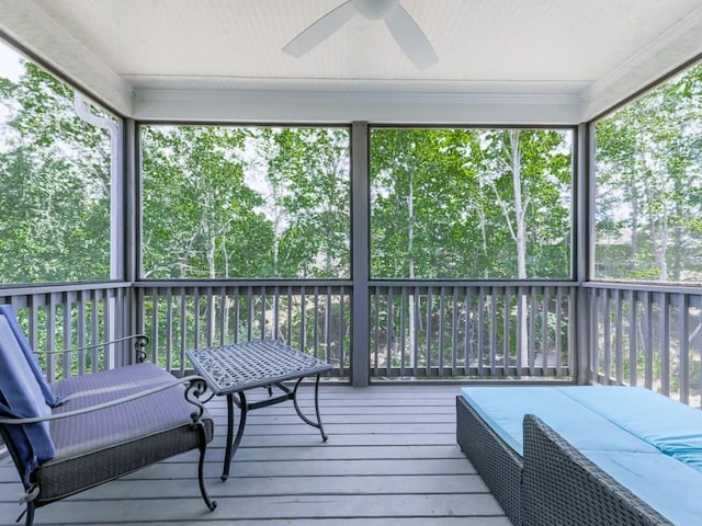sunroom with a ceiling fan and healthy amount of natural light