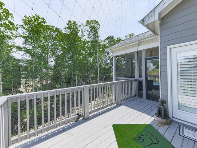 wooden terrace featuring a sunroom