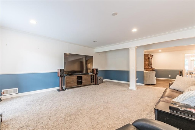 carpeted living room featuring ornamental molding