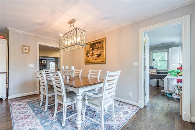 dining area featuring ornamental molding and dark hardwood / wood-style flooring