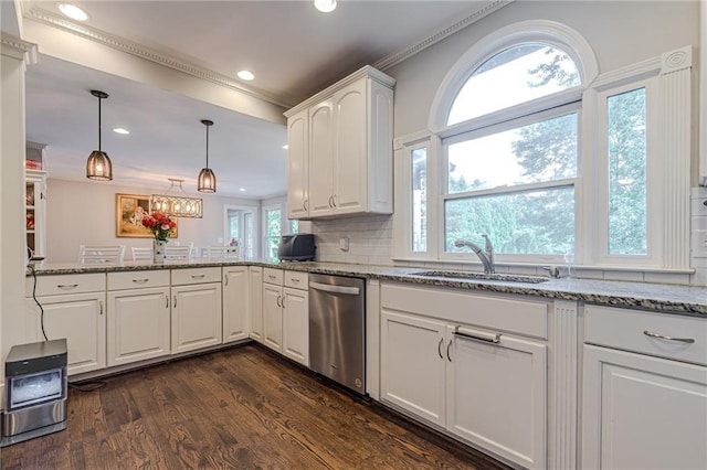 kitchen with dishwasher, sink, white cabinetry, dark hardwood / wood-style floors, and kitchen peninsula