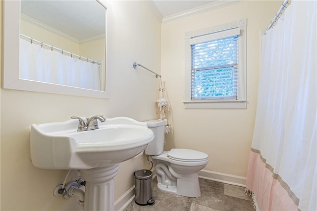 bathroom with ornamental molding and toilet