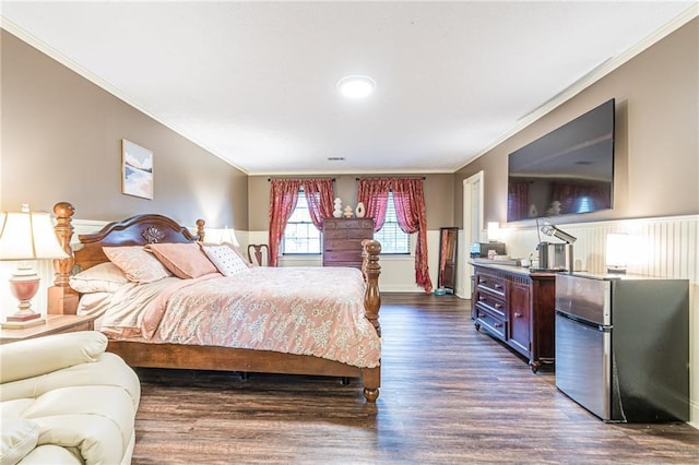 bedroom featuring stainless steel refrigerator, crown molding, and dark wood-type flooring