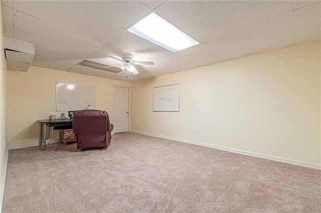 interior space with ceiling fan and a paneled ceiling