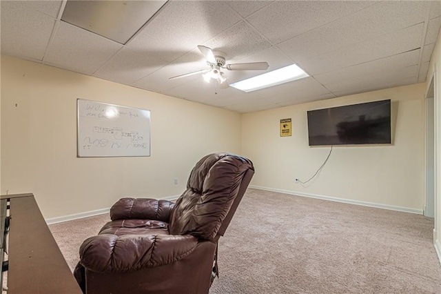 interior space featuring carpet floors, a paneled ceiling, and ceiling fan