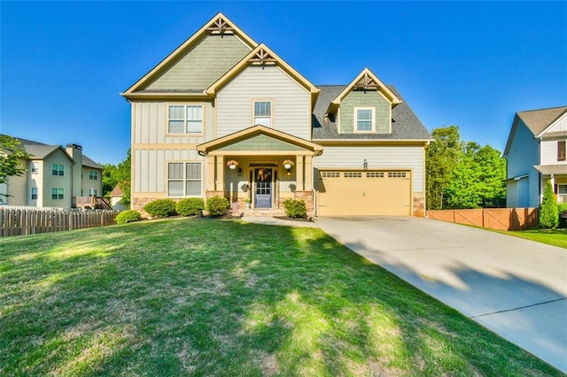 craftsman-style house with a garage, fence, a front yard, board and batten siding, and driveway