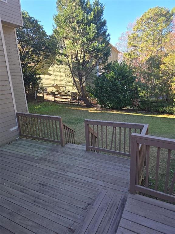 deck featuring a lawn