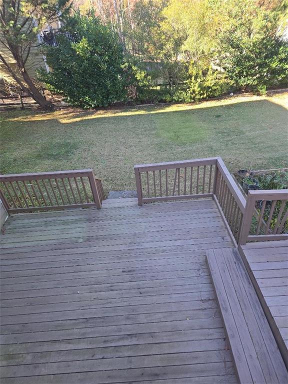 wooden deck with a yard