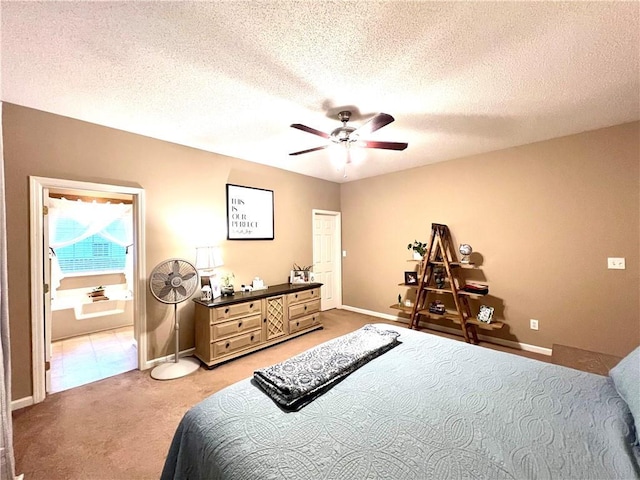 bedroom featuring light carpet, baseboards, ceiling fan, and a textured ceiling