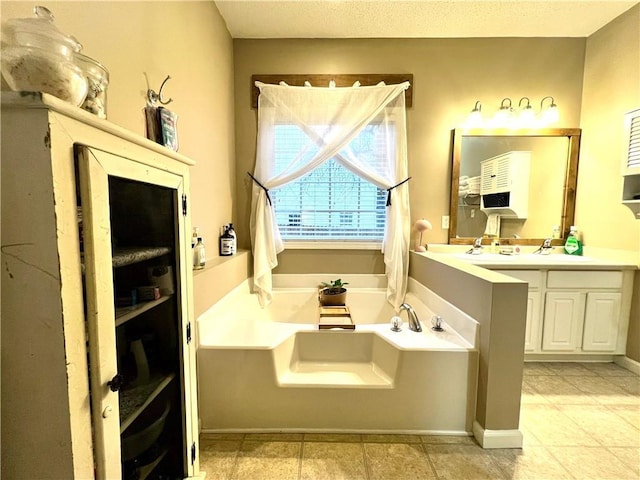 bathroom with vanity and a garden tub