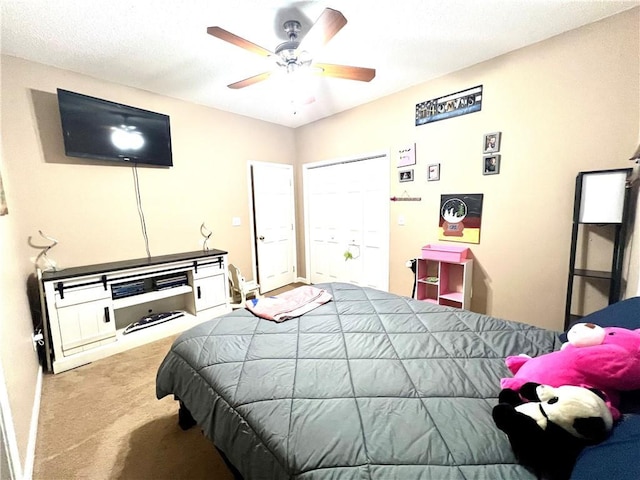 carpeted bedroom with a ceiling fan
