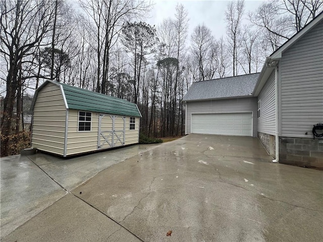 garage featuring driveway