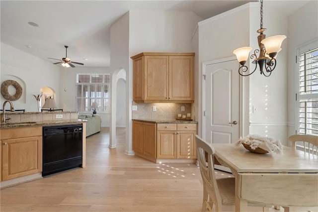 kitchen with ceiling fan with notable chandelier, light brown cabinets, black dishwasher, and a sink