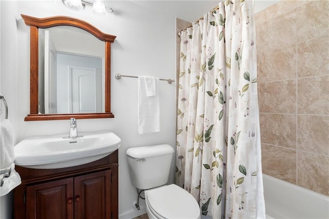 bathroom with toilet, vanity, and shower / bath combination with curtain