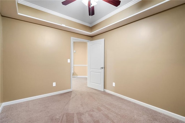 unfurnished room featuring ceiling fan, baseboards, crown molding, and carpet