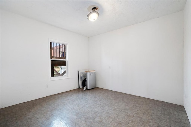 empty room featuring tile patterned floors