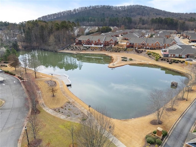 birds eye view of property featuring a residential view and a water and mountain view