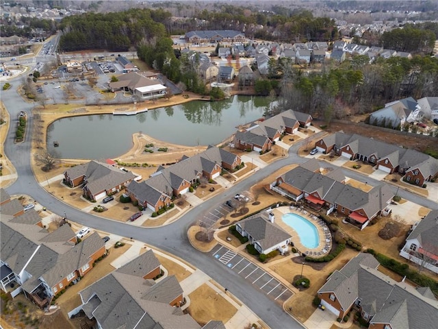 bird's eye view with a residential view and a water view