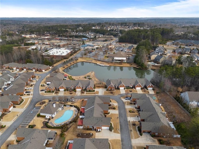 bird's eye view featuring a residential view and a water view