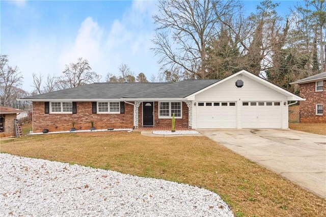 1283 Woodleigh Rd SW, Marietta, GA 30008 - ranch-style home featuring a garage and a front yard