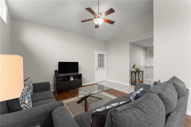 1283 Woodleigh Rd SW, Marietta, GA 30008 - living room with ceiling fan, high vaulted ceiling, and wood-type flooring