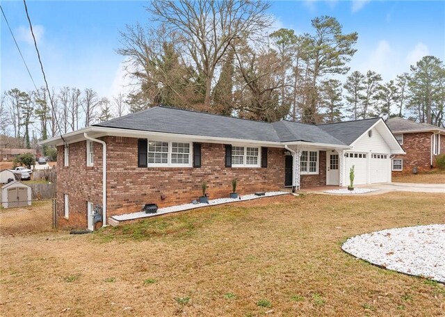1283 Woodleigh Rd SW, Marietta, GA 30008 - ranch-style home with a front lawn and a garage