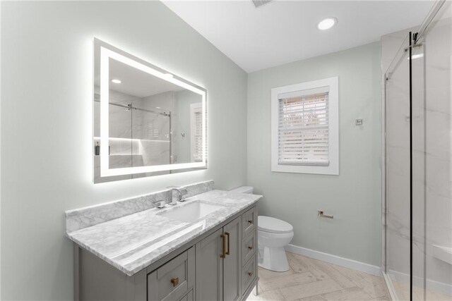 1283 Woodleigh Rd SW, Marietta, GA 30008 - bathroom with vanity, a shower with shower door, and toilet
