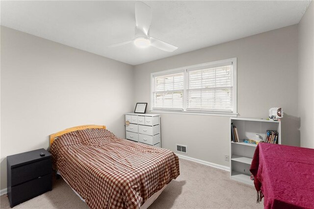1283 Woodleigh Rd SW, Marietta, GA 30008 - bedroom with ceiling fan and light colored carpet