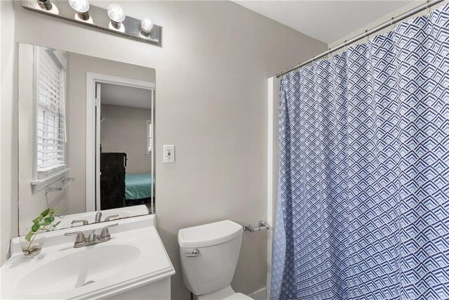 1283 Woodleigh Rd SW, Marietta, GA 30008 - bathroom featuring vanity and toilet