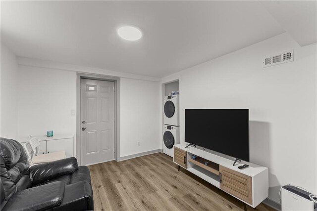 1283 Woodleigh Rd SW, Marietta, GA 30008 - living room with light hardwood / wood-style flooring and stacked washer and clothes dryer