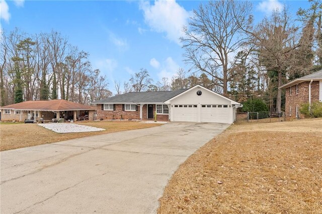 1283 Woodleigh Rd SW, Marietta, GA 30008 - view of front facade featuring a garage and a front lawn