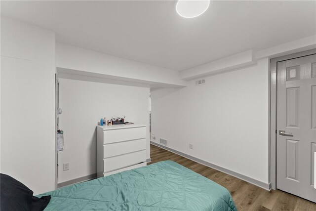 1283 Woodleigh Rd SW, Marietta, GA 30008 - bedroom featuring hardwood / wood-style floors
