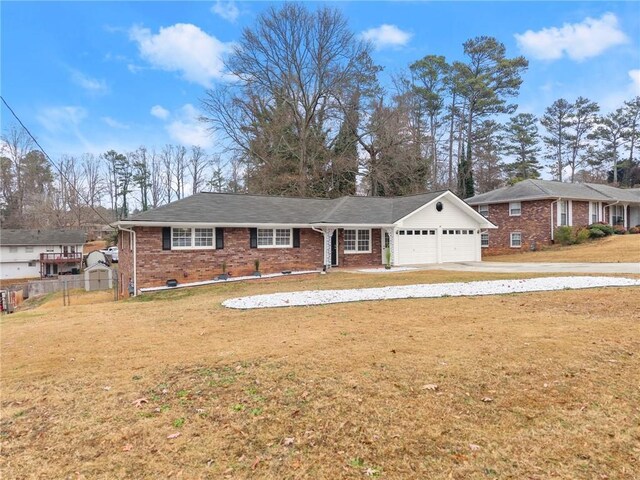 1283 Woodleigh Rd SW, Marietta, GA 30008 - ranch-style house with a garage and a front lawn