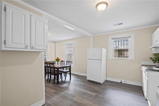 1591 Jonesboro Rd SE, Atlanta, GA 30315 - kitchen with white appliances, baseboards, white cabinets, plenty of natural light, and ornamental molding