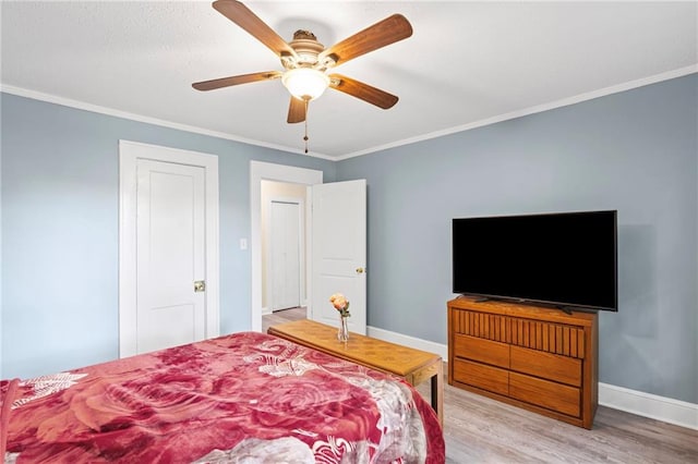 1591 Jonesboro Rd SE, Atlanta, GA 30315 - bedroom featuring crown molding, baseboards, wood finished floors, and ceiling fan