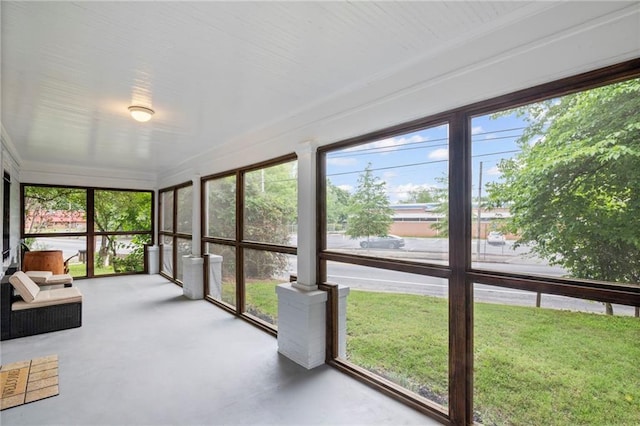 1591 Jonesboro Rd SE, Atlanta, GA 30315 - unfurnished sunroom with healthy amount of natural light and concrete floors