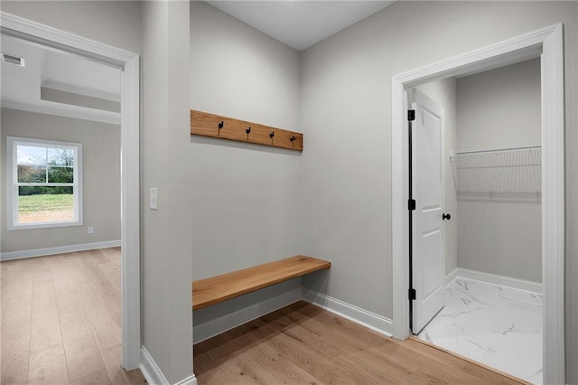 mudroom with light hardwood / wood-style flooring