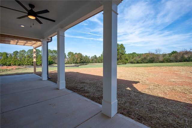 view of patio featuring ceiling fan