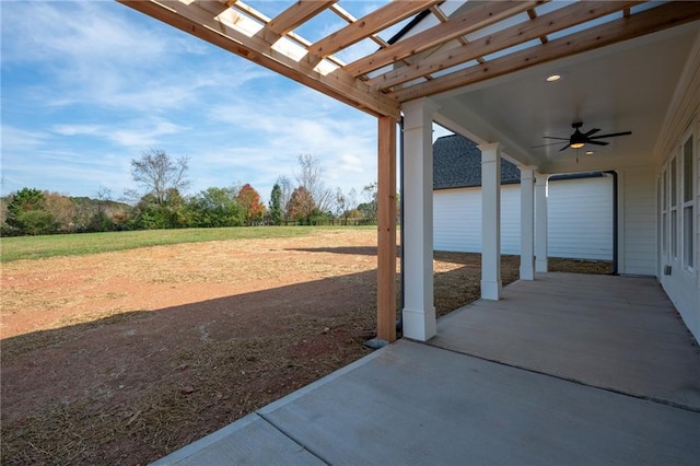 view of patio / terrace featuring ceiling fan and a pergola