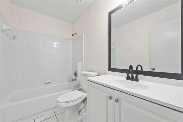 full bathroom with tile patterned floors, tiled shower / bath combo, toilet, and vanity