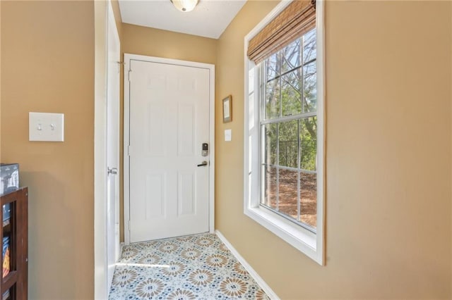 entryway featuring tile patterned floors and baseboards