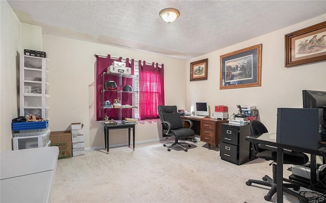 carpeted office space with a textured ceiling