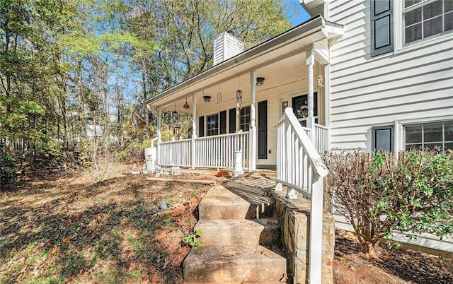 doorway to property featuring a porch