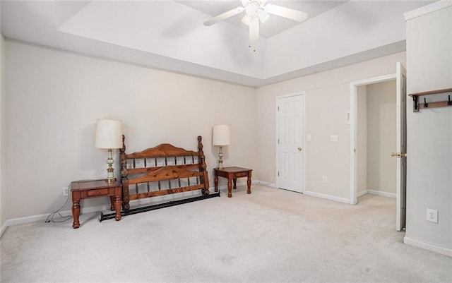 interior space with ceiling fan and light colored carpet