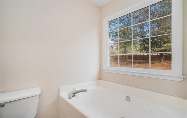 bathroom with a bathtub and toilet