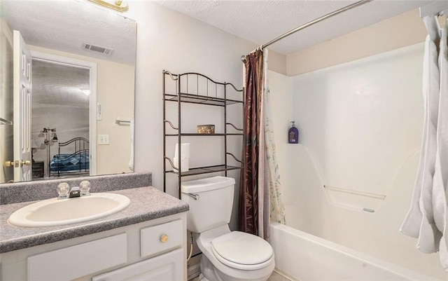 full bathroom featuring toilet, a textured ceiling, vanity, and shower / tub combo with curtain