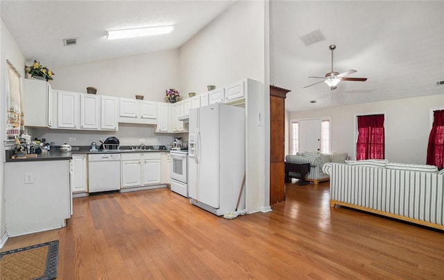 kitchen featuring ceiling fan, high vaulted ceiling, light hardwood / wood-style floors, white appliances, and white cabinets