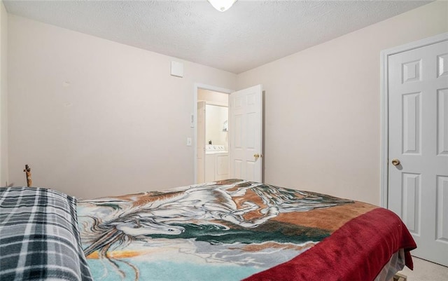 bedroom featuring carpet and a textured ceiling